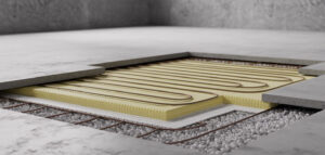 Tvärsnitt av vattenburen golvvärme installation i betong.